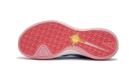 Bottom sole view of a pink athletic shoe with red patterned tread and yellow accent lighting
