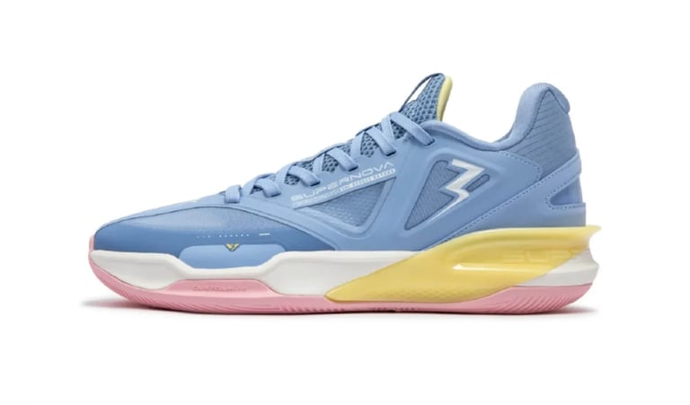 Blue and pink basketball shoe with yellow midsole and white accent stripe on the side, displayed against white background