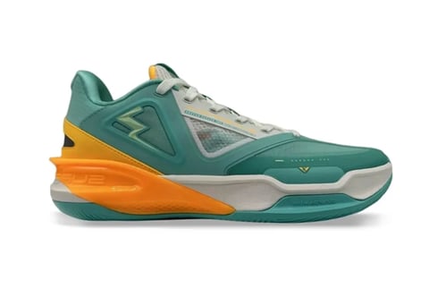 Teal and orange basketball shoe with white midsole and gray mesh panels, displayed from side view