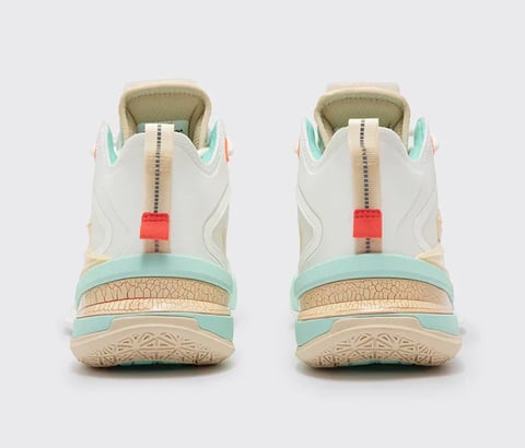 Rear view of white and turquoise high-top sneakers with red tongue pulls and beige sole accents
