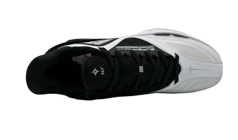 Top-down view of a black and white athletic shoe with laces and a ventilated design on white background